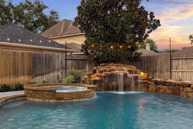 1611 Barrington Hills Ln, Katy, TX 77450 - pool at dusk featuring a pool with connected hot tub
