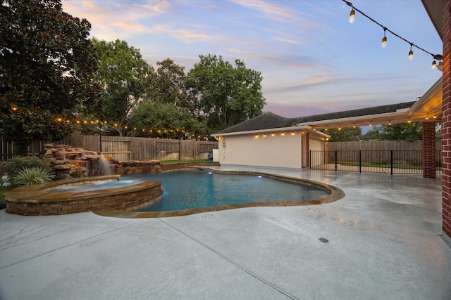 1611 Barrington Hills Ln, Katy, TX 77450 - view of swimming pool with a patio, a pool with connected hot tub, a fenced backyard, and an outdoor structure