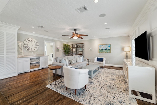 2603 Haverhill Dr, Houston, TX 77008 - living room featuring dark wood-type flooring, a ceiling fan, recessed lighting, and ornamental molding