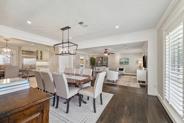 2603 Haverhill Dr, Houston, TX 77008 - dining space with dark wood-type flooring, crown molding, ceiling fan, and recessed lighting