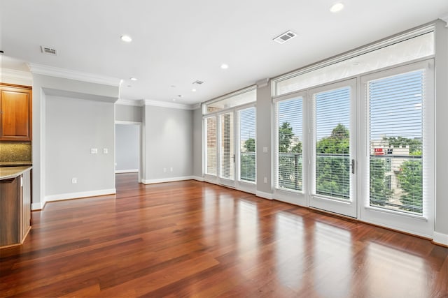1419 Montrose Blvd Unit 301, Houston, TX 77019 - unfurnished living room featuring ornamental molding, dark wood-type flooring, and recessed lighting
