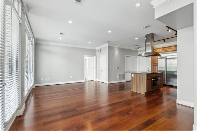 1419 Montrose Blvd Unit 301, Houston, TX 77019 - unfurnished living room with ornamental molding, dark wood-type flooring, and recessed lighting