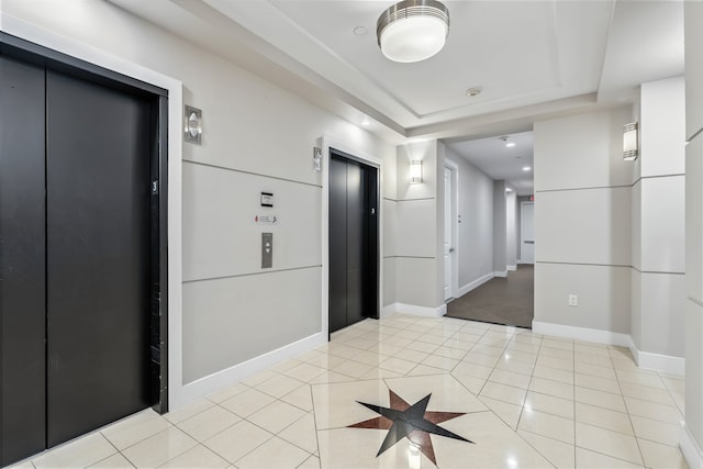1419 Montrose Blvd Unit 301, Houston, TX 77019 - unfurnished room with elevator, light tile patterned floors, a tray ceiling, and a smoke detector