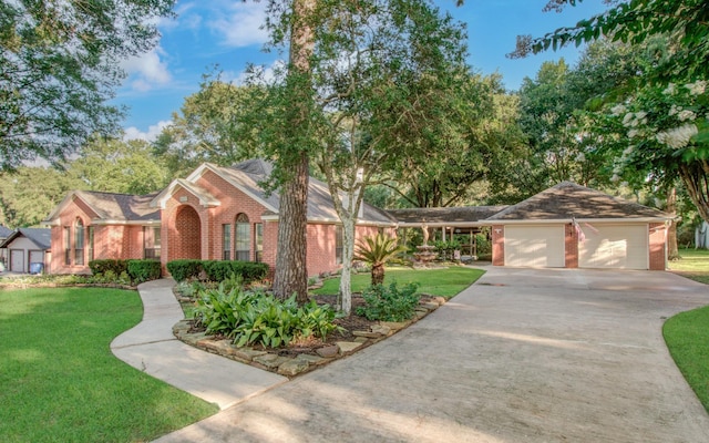 24806 Silver Leaf St, Magnolia, TX 77355 - view of front of home featuring concrete driveway, brick siding, a garage, and a front yard