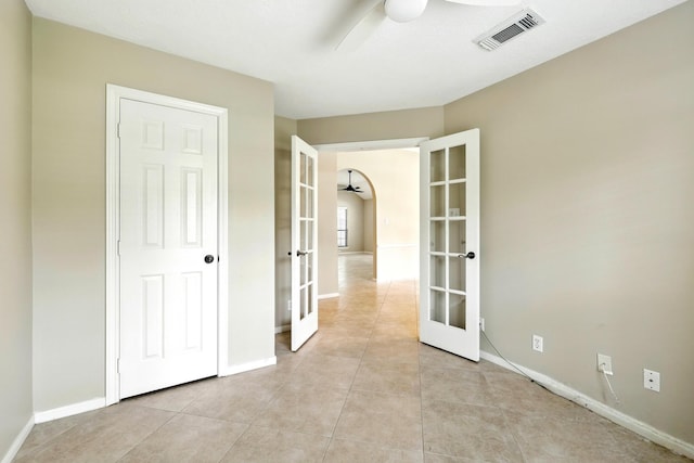 24806 Silver Leaf St, Magnolia, TX 77355 - empty room with french doors, ceiling fan, and light tile patterned floors