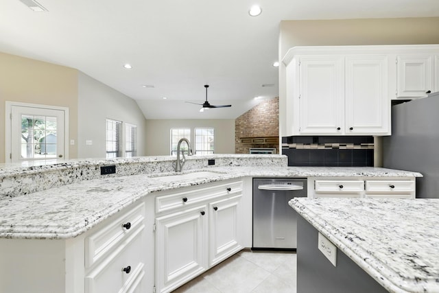 24806 Silver Leaf St, Magnolia, TX 77355 - kitchen featuring stainless steel appliances, ceiling fan, decorative backsplash, light stone countertops, and plenty of natural light