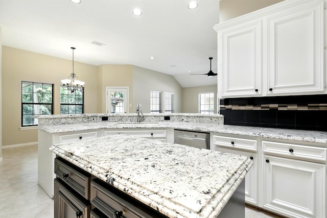 24806 Silver Leaf St, Magnolia, TX 77355 - kitchen with ceiling fan, stainless steel dishwasher, a chandelier, light stone counters, and recessed lighting