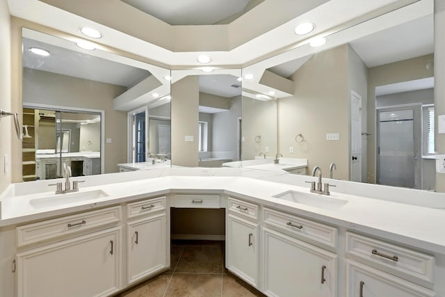 24806 Silver Leaf St, Magnolia, TX 77355 - bathroom featuring double vanity, recessed lighting, tile patterned flooring, and a stall shower