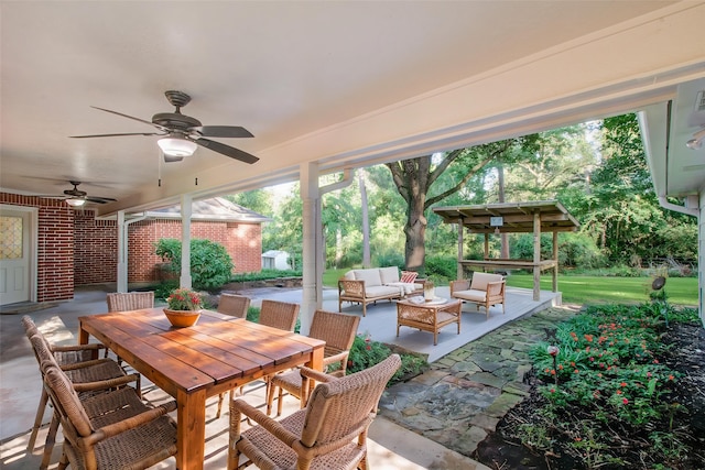 24806 Silver Leaf St, Magnolia, TX 77355 - view of patio with an outdoor hangout area, a ceiling fan, and outdoor dining area