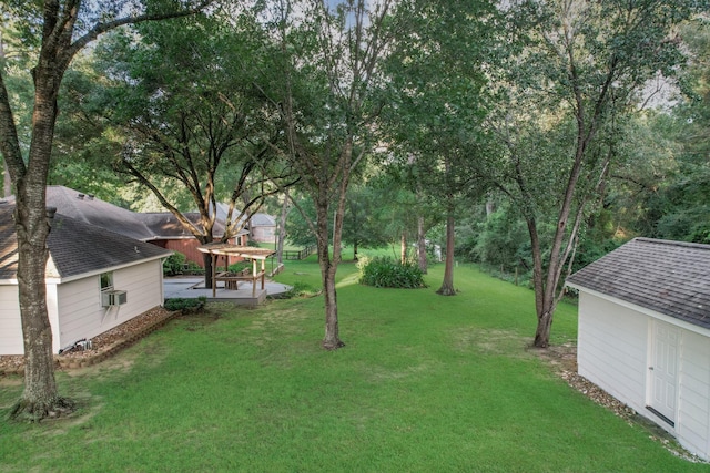 24806 Silver Leaf St, Magnolia, TX 77355 - view of grassy yard with a patio area, a storage shed, and cooling unit