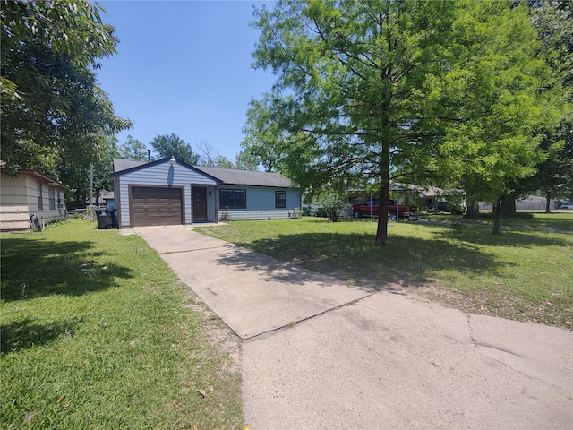 6714 Underhill St, Houston, TX 77092 - view of front of property featuring concrete driveway, a front yard, and an attached garage