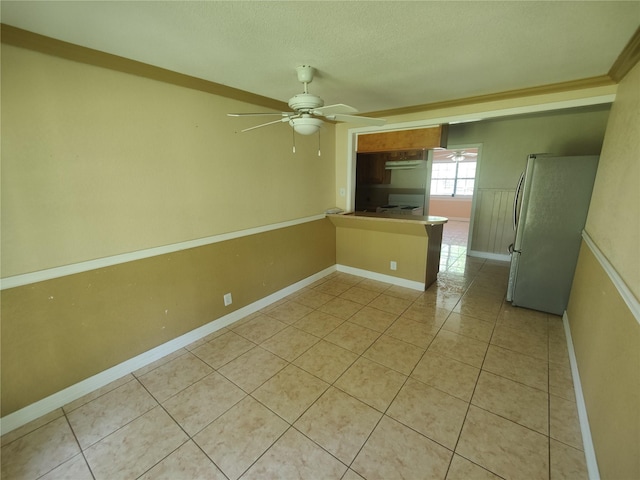 6714 Underhill St, Houston, TX 77092 - spare room with ceiling fan, light tile patterned flooring, and a textured ceiling