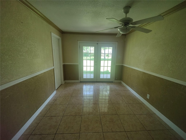 6714 Underhill St, Houston, TX 77092 - tiled empty room featuring a textured wall, a textured ceiling, ceiling fan, and ornamental molding