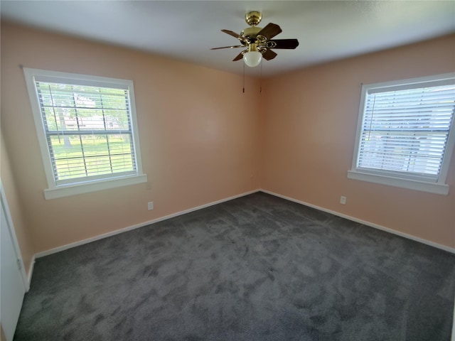 6714 Underhill St, Houston, TX 77092 - unfurnished room featuring healthy amount of natural light, dark carpet, and a ceiling fan