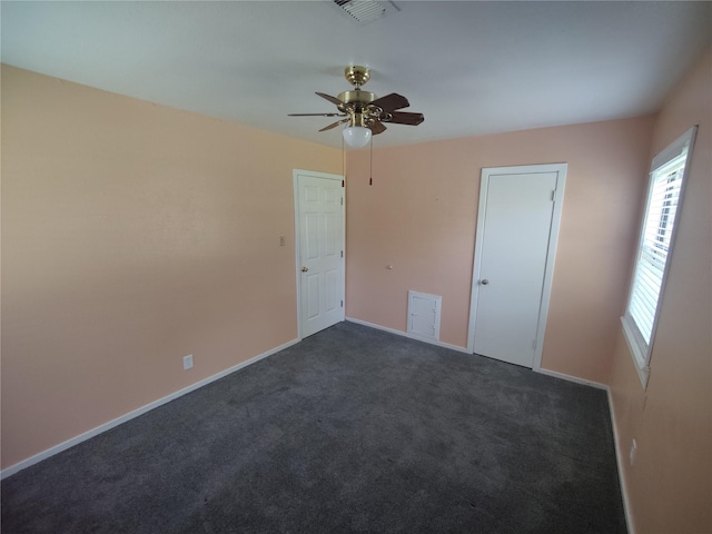 6714 Underhill St, Houston, TX 77092 - unfurnished bedroom with dark colored carpet and ceiling fan
