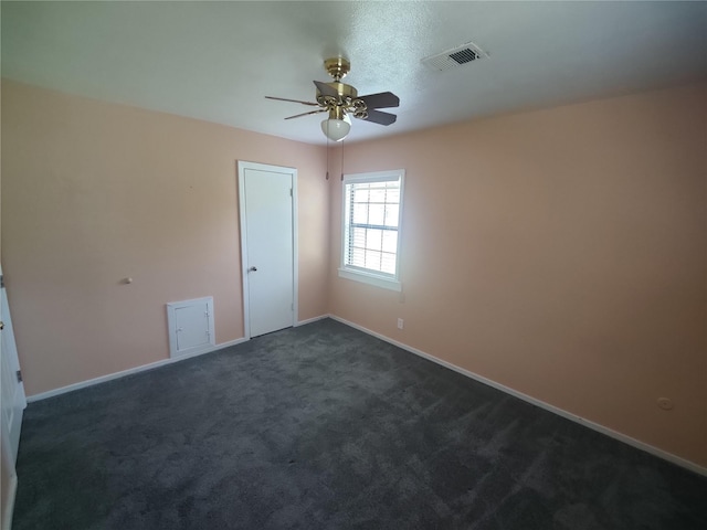 6714 Underhill St, Houston, TX 77092 - spare room featuring dark carpet and a ceiling fan