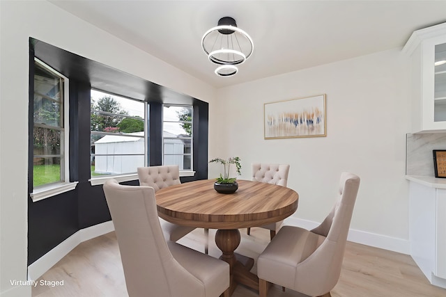 13019 Foxburo Dr, Houston, TX 77065 - dining space with baseboards and light wood-type flooring