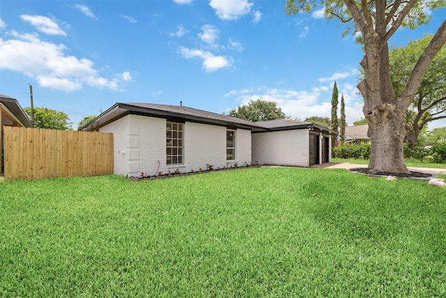 13019 Foxburo Dr, Houston, TX 77065 - back of house with a garage, brick siding, and driveway