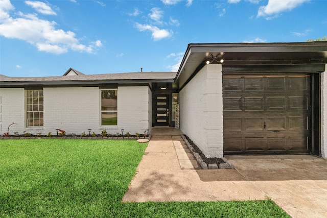 13019 Foxburo Dr, Houston, TX 77065 - view of front facade with brick siding, concrete driveway, a front lawn, and an attached garage