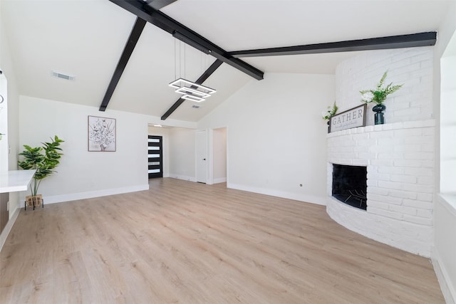 13019 Foxburo Dr, Houston, TX 77065 - unfurnished living room featuring light wood-style flooring and a brick fireplace