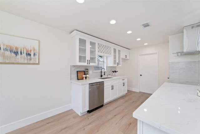 13019 Foxburo Dr, Houston, TX 77065 - kitchen with dishwasher, light wood-type flooring, glass insert cabinets, light stone counters, and recessed lighting