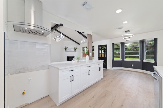 13019 Foxburo Dr, Houston, TX 77065 - kitchen featuring light wood finished floors, white cabinets, light countertops, range hood, and stainless steel dishwasher