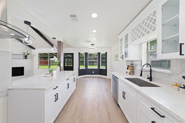 13019 Foxburo Dr, Houston, TX 77065 - kitchen featuring dishwasher, light wood-style floors, white cabinetry, recessed lighting, and light stone countertops