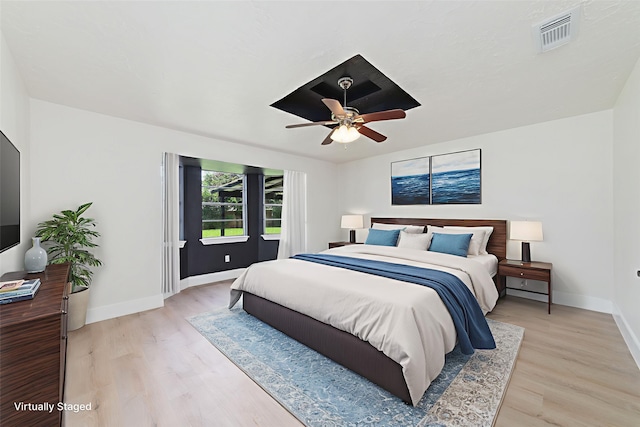 13019 Foxburo Dr, Houston, TX 77065 - bedroom featuring light wood-style flooring and ceiling fan