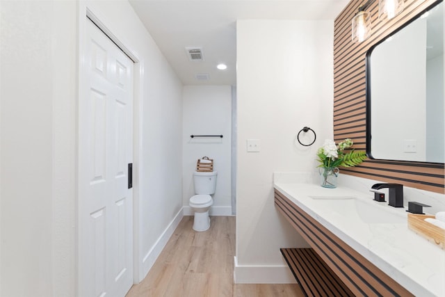 13019 Foxburo Dr, Houston, TX 77065 - bathroom featuring vanity, wood finished floors, and recessed lighting