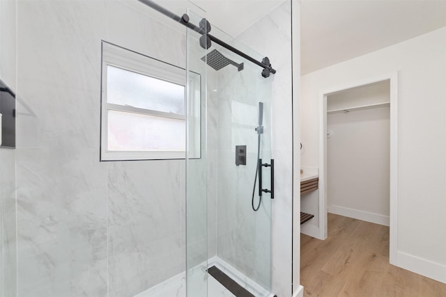 13019 Foxburo Dr, Houston, TX 77065 - full bath featuring a marble finish shower, a walk in closet, and wood finished floors