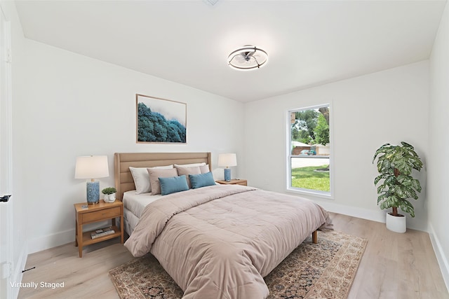 13019 Foxburo Dr, Houston, TX 77065 - bedroom with baseboards and light wood-type flooring