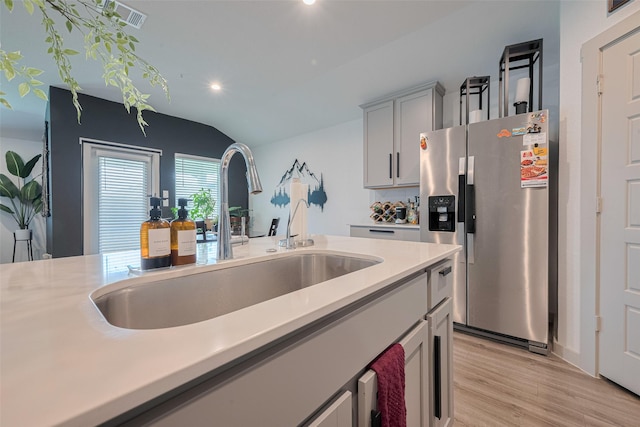 7822 Murciana Dr, Rosharon, TX 77583 - kitchen featuring stainless steel fridge, recessed lighting, light wood-style floors, light countertops, and gray cabinets