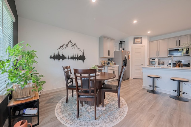 7822 Murciana Dr, Rosharon, TX 77583 - dining room featuring light wood-style flooring and recessed lighting