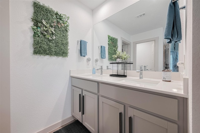7822 Murciana Dr, Rosharon, TX 77583 - full bathroom featuring double vanity and a textured wall