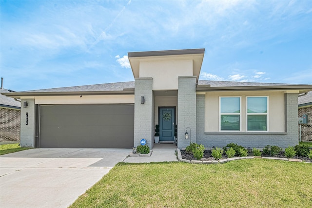 7822 Murciana Dr, Rosharon, TX 77583 - view of front of house featuring an attached garage, brick siding, driveway, a front lawn, and stucco siding