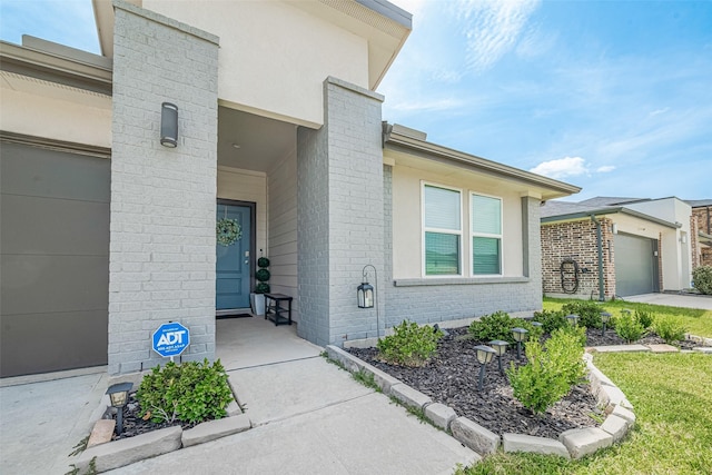 7822 Murciana Dr, Rosharon, TX 77583 - entrance to property featuring a garage and brick siding