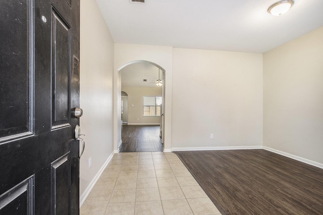 20515 Rustic Rail Ct, Cypress, TX 77433 - entryway with arched walkways, tile patterned floors, and ceiling fan