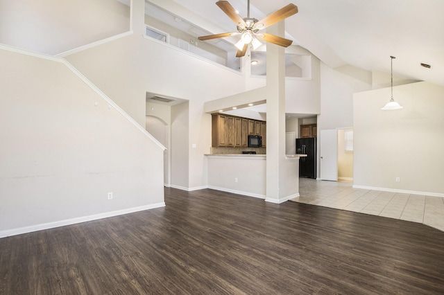 20515 Rustic Rail Ct, Cypress, TX 77433 - unfurnished living room with ceiling fan, wood finished floors, and high vaulted ceiling