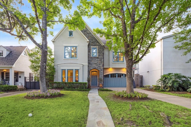 3614 University Blvd, West University Place, TX 77005 - view of front of home featuring stucco siding, driveway, stone siding, a front yard, and a garage