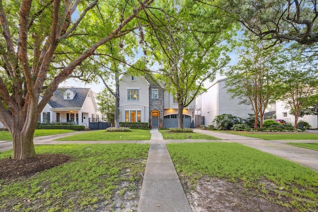 3614 University Blvd, West University Place, TX 77005 - view of front of property with concrete driveway, a garage, a front yard, and stucco siding
