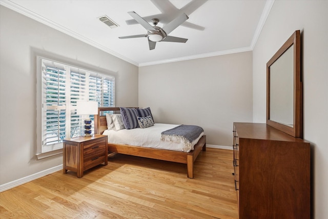 3614 University Blvd, West University Place, TX 77005 - bedroom with ornamental molding, light wood-style floors, multiple windows, and ceiling fan