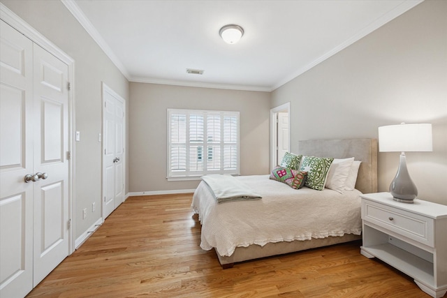 3614 University Blvd, West University Place, TX 77005 - bedroom featuring ornamental molding and light wood-style flooring