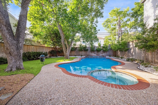 3614 University Blvd, West University Place, TX 77005 - view of swimming pool featuring a pool with connected hot tub and a fenced backyard