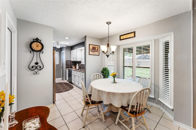 3426 Acorn Springs Ln, Spring, TX 77389 - dining room with light tile patterned floors, a textured ceiling, a chandelier, and recessed lighting