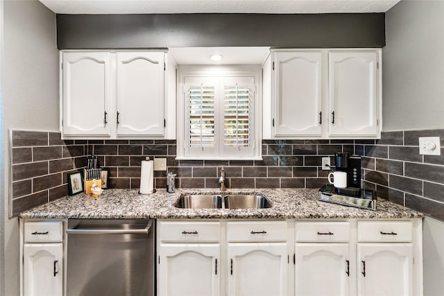 3426 Acorn Springs Ln, Spring, TX 77389 - kitchen featuring stainless steel dishwasher, white cabinetry, decorative backsplash, and light stone counters