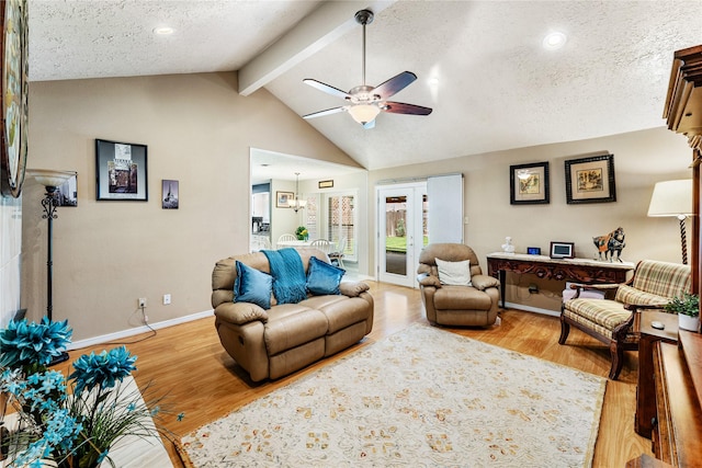 3426 Acorn Springs Ln, Spring, TX 77389 - living room with ceiling fan, light wood-style floors, and a textured ceiling