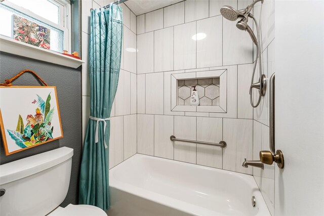 3426 Acorn Springs Ln, Spring, TX 77389 - bathroom featuring shower / bath combo with shower curtain and toilet
