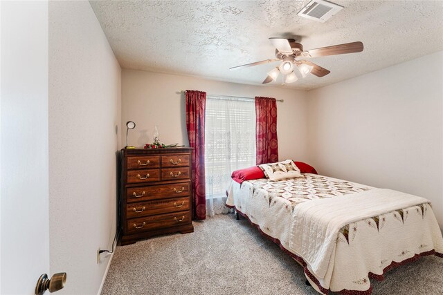 3426 Acorn Springs Ln, Spring, TX 77389 - carpeted bedroom with a textured ceiling and ceiling fan