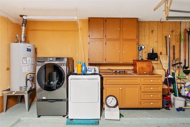 3426 Acorn Springs Ln, Spring, TX 77389 - washroom featuring cabinet space, water heater, and washing machine and dryer