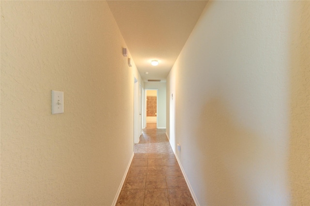 14839 Fir Knoll Way, Cypress, TX 77429 - hallway featuring baseboards and light tile patterned floors